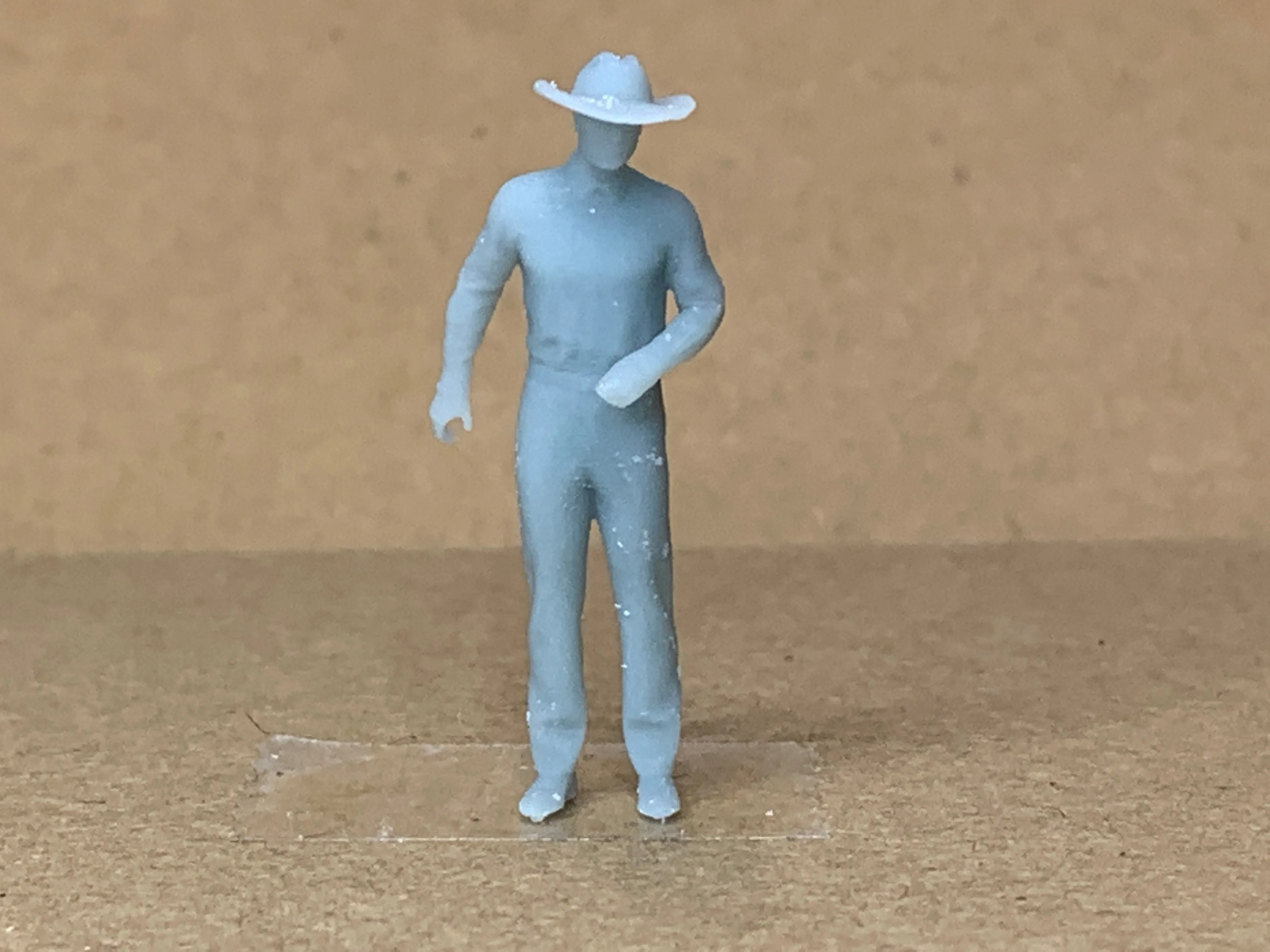 Man Standing Arm Bent Wearing Large Hat